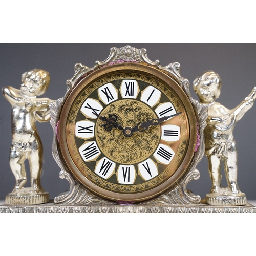 212 - West German Splendex mantle clock adorned with musical cherub decoration