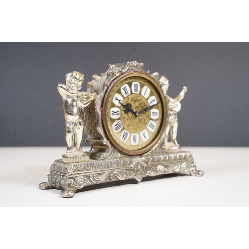 212 - West German Splendex mantle clock adorned with musical cherub decoration
