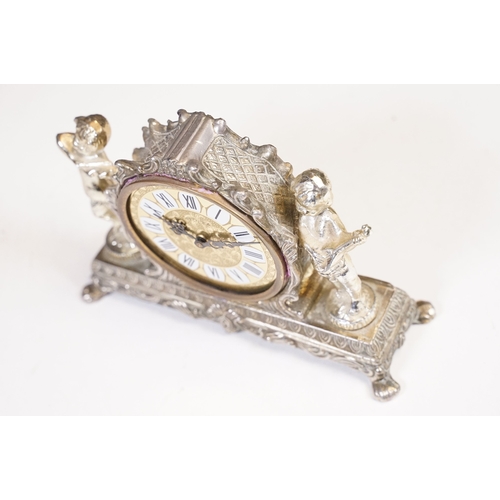 212 - West German Splendex mantle clock adorned with musical cherub decoration