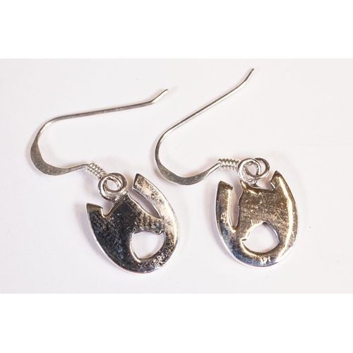 221 - Pair of silver horse and horse shoe earrings.