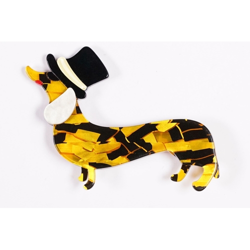 231 - A contemporary Lea Stein style brooch in the form of a Sausage Dog / Dachshund wearing a Top Hat, me... 