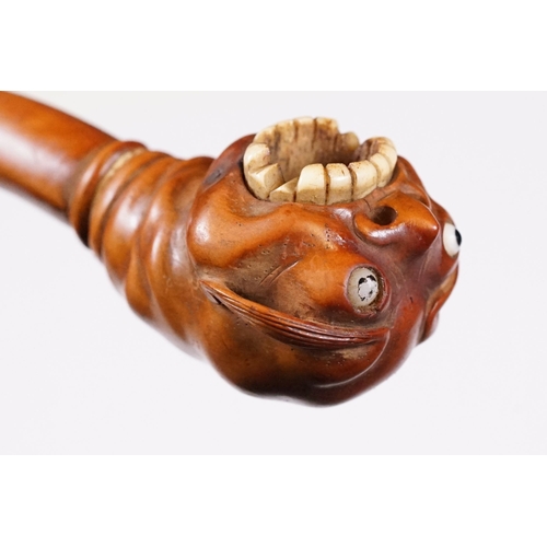 236 - Japanese smoking pipe in the form of a demon, possibly Meiji period with bone inlay, L 11cm