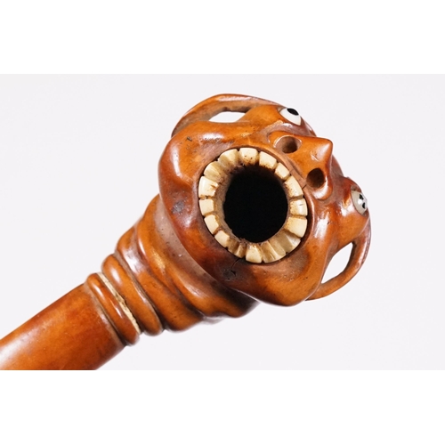 236 - Japanese smoking pipe in the form of a demon, possibly Meiji period with bone inlay, L 11cm