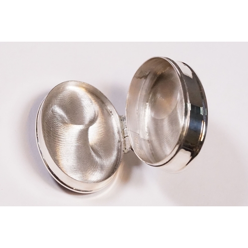 256 - Silver oval shaped pill box with enamel lid.