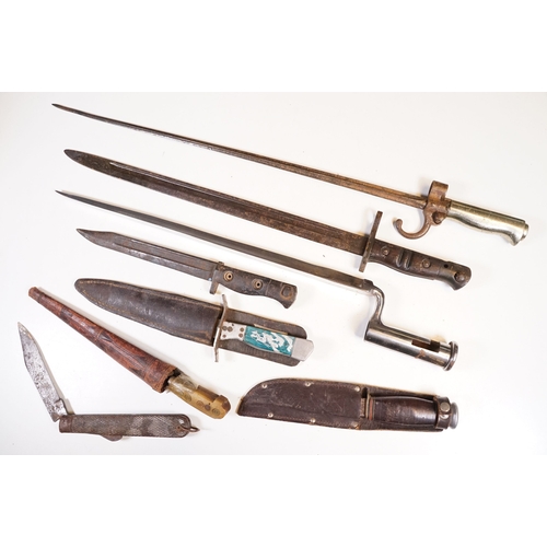279 - A collection of knives and bayonets to include a French cruciform 1886 Label example.