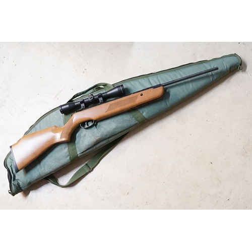 287 - A SMK19 .22 Cal break barrel air rifle with contemporary green soft gun carry case.