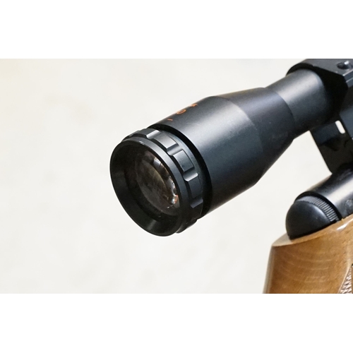 287 - A SMK19 .22 Cal break barrel air rifle with contemporary green soft gun carry case.