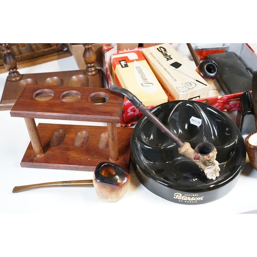 303 - A collection of mixed smoking pipes to include estate pipes, pipe racks, pipe holders, pipe rests...... 