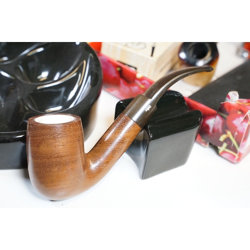 303 - A collection of mixed smoking pipes to include estate pipes, pipe racks, pipe holders, pipe rests...... 