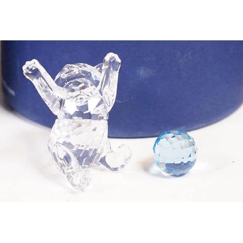 306 - A box of mixed collectables to include tinplate toy, swarovski ornaments, hip flask, oriental white ... 