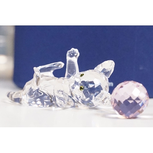 306 - A box of mixed collectables to include tinplate toy, swarovski ornaments, hip flask, oriental white ... 