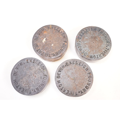 313 - A collection of four cast iron weights commemorating the 1977 silver jubilee of Queen Elizabeth II, ... 