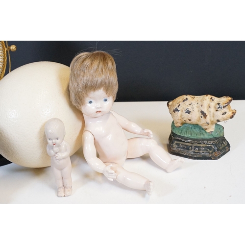 328 - A box of mixed collectables to include ostrich egg, doll, trinket boxes, door stop... etc...