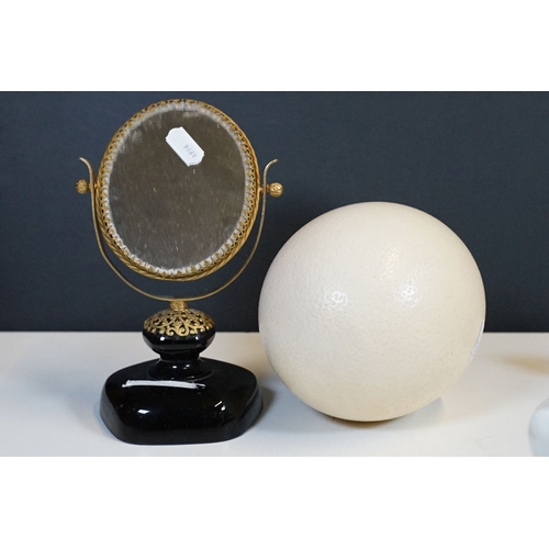 328 - A box of mixed collectables to include ostrich egg, doll, trinket boxes, door stop... etc...