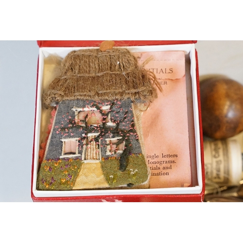 329 - An antique wooden fitted sewing box complete with contents to include needles, thimbles ...etc..