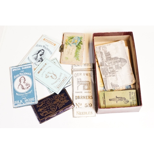 329 - An antique wooden fitted sewing box complete with contents to include needles, thimbles ...etc..