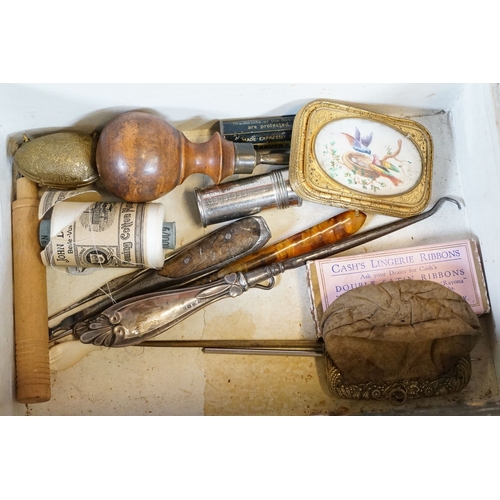 329 - An antique wooden fitted sewing box complete with contents to include needles, thimbles ...etc..