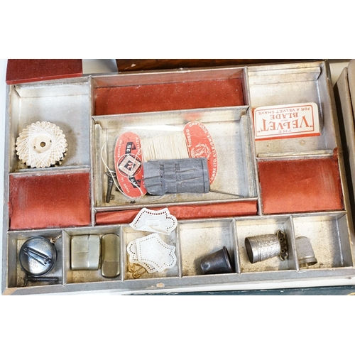 329 - An antique wooden fitted sewing box complete with contents to include needles, thimbles ...etc..
