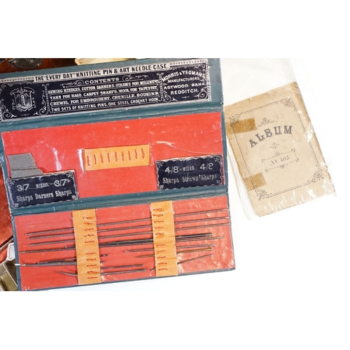 329 - An antique wooden fitted sewing box complete with contents to include needles, thimbles ...etc..