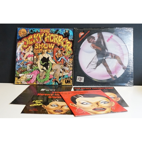 331 - A Rocky Horror Picture Show vinyl picture disc together with four souvenir programmes.