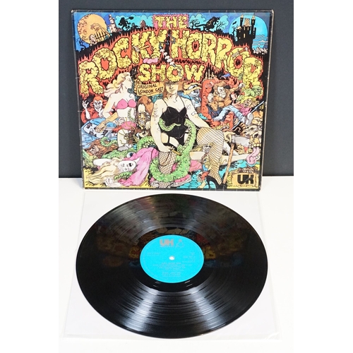 331 - A Rocky Horror Picture Show vinyl picture disc together with four souvenir programmes.