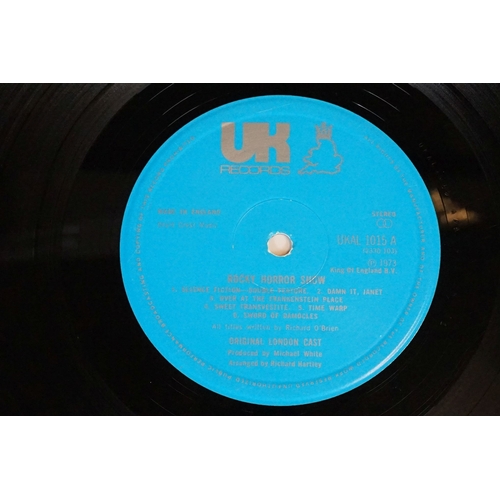 331 - A Rocky Horror Picture Show vinyl picture disc together with four souvenir programmes.