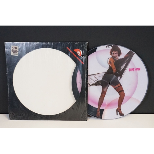 331 - A Rocky Horror Picture Show vinyl picture disc together with four souvenir programmes.