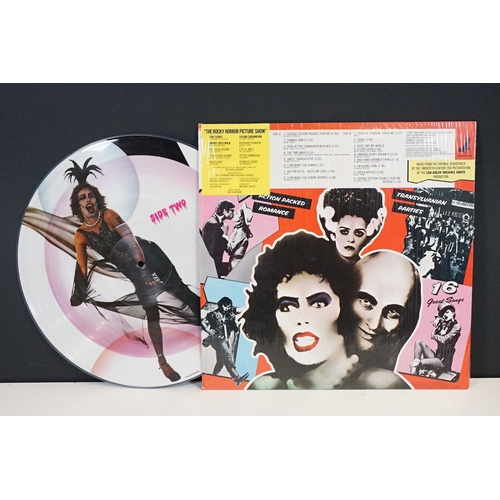 331 - A Rocky Horror Picture Show vinyl picture disc together with four souvenir programmes.