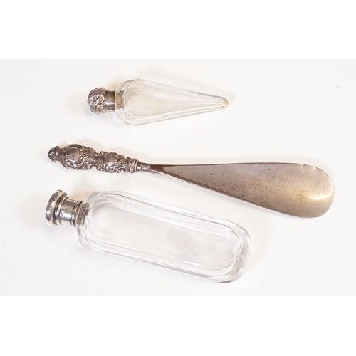 333 - A collection of vanity jars and bottles to include silver topped examples.