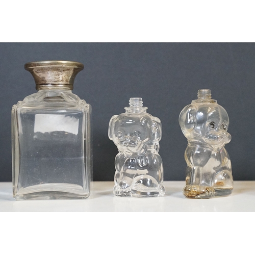 333 - A collection of vanity jars and bottles to include silver topped examples.