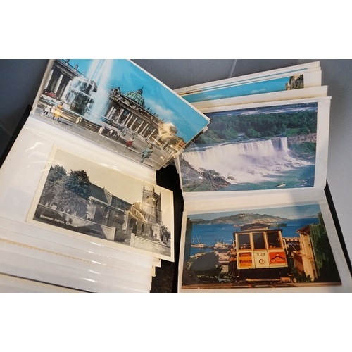 435 - A large collection of early 20th century postcards to include printed and real photo examples, mainl... 