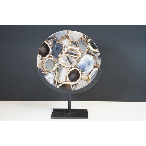 95 - Agate circular plaque, mounted on a stand, 24.5cm, diameter, height including stand 34cm