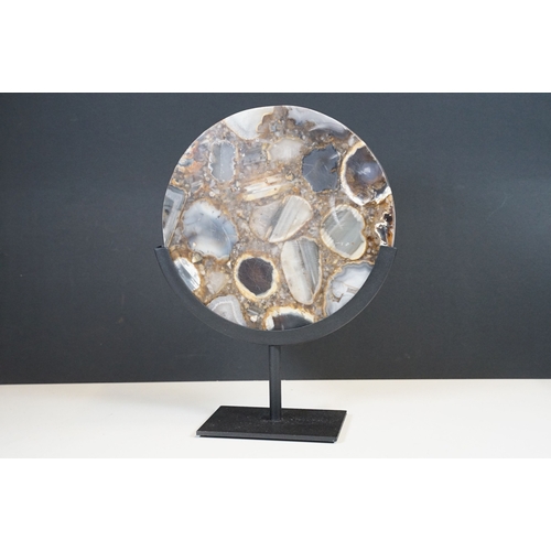 95 - Agate circular plaque, mounted on a stand, 24.5cm, diameter, height including stand 34cm