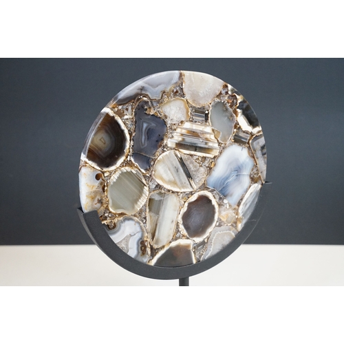 95 - Agate circular plaque, mounted on a stand, 24.5cm, diameter, height including stand 34cm
