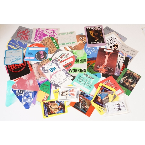 406 - A small collection of NME / New Musical Express newspaper magazines and a selection of backstage pas... 