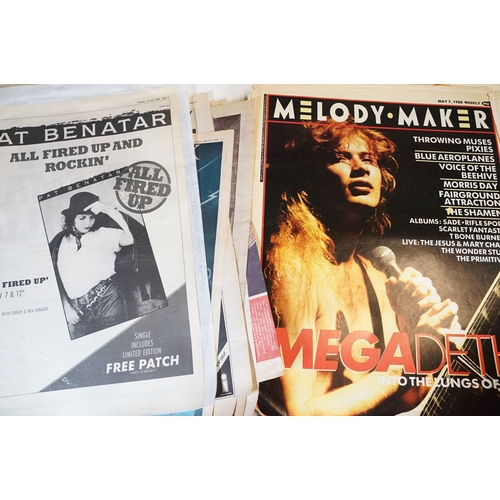 406 - A small collection of NME / New Musical Express newspaper magazines and a selection of backstage pas... 
