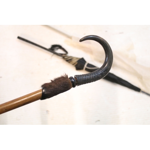 335 - Victorian parasol, with carved ebonised handle and black silk canopy, a Victorian parasol with carve... 