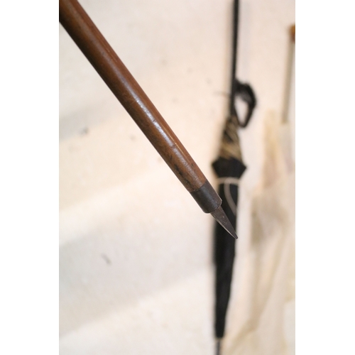 335 - Victorian parasol, with carved ebonised handle and black silk canopy, a Victorian parasol with carve... 