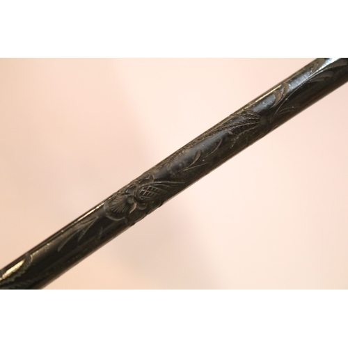 335 - Victorian parasol, with carved ebonised handle and black silk canopy, a Victorian parasol with carve... 