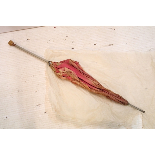 335 - Victorian parasol, with carved ebonised handle and black silk canopy, a Victorian parasol with carve... 