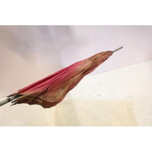 335 - Victorian parasol, with carved ebonised handle and black silk canopy, a Victorian parasol with carve... 