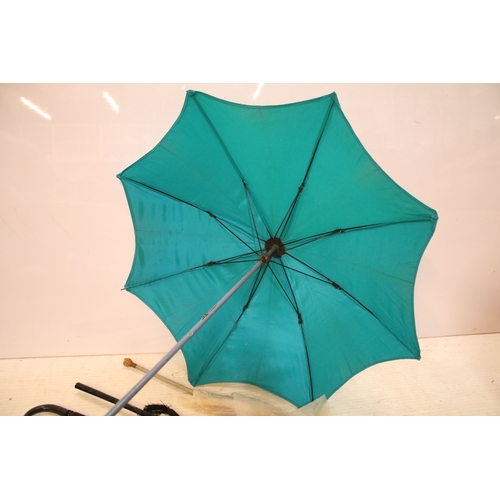 335 - Victorian parasol, with carved ebonised handle and black silk canopy, a Victorian parasol with carve... 