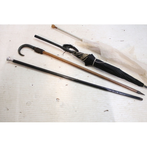 335 - Victorian parasol, with carved ebonised handle and black silk canopy, a Victorian parasol with carve... 