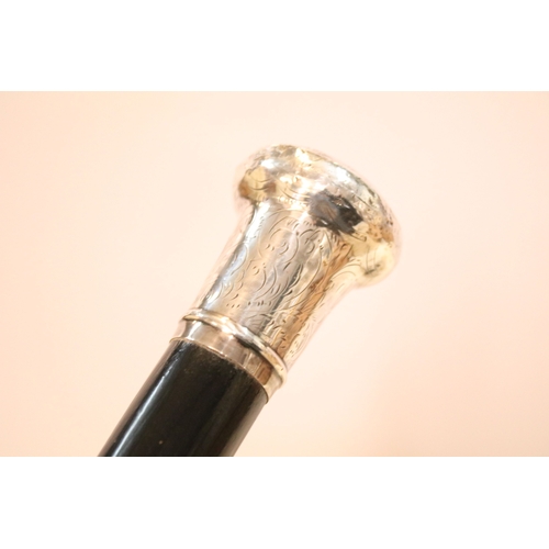 335 - Victorian parasol, with carved ebonised handle and black silk canopy, a Victorian parasol with carve... 