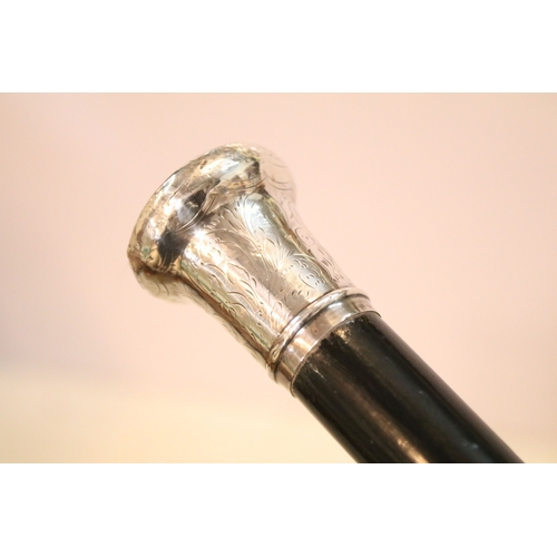 335 - Victorian parasol, with carved ebonised handle and black silk canopy, a Victorian parasol with carve... 