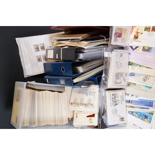409 - A large collection of world first day covers together with a selection of stamps within albums to in... 
