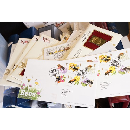 409 - A large collection of world first day covers together with a selection of stamps within albums to in... 