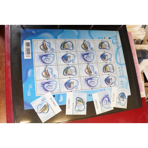 409 - A large collection of world first day covers together with a selection of stamps within albums to in... 