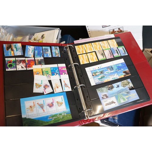 409 - A large collection of world first day covers together with a selection of stamps within albums to in... 