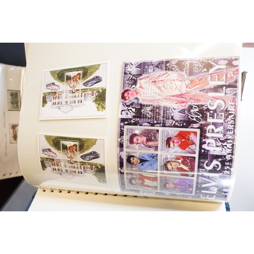 409 - A large collection of world first day covers together with a selection of stamps within albums to in... 